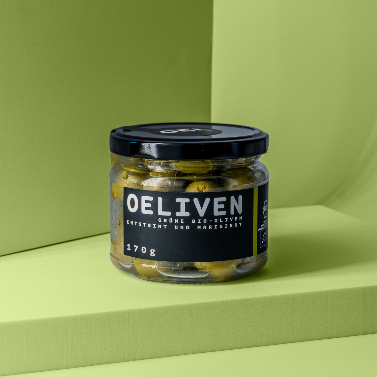 Glas Grüne Bio-Oliven entsteint